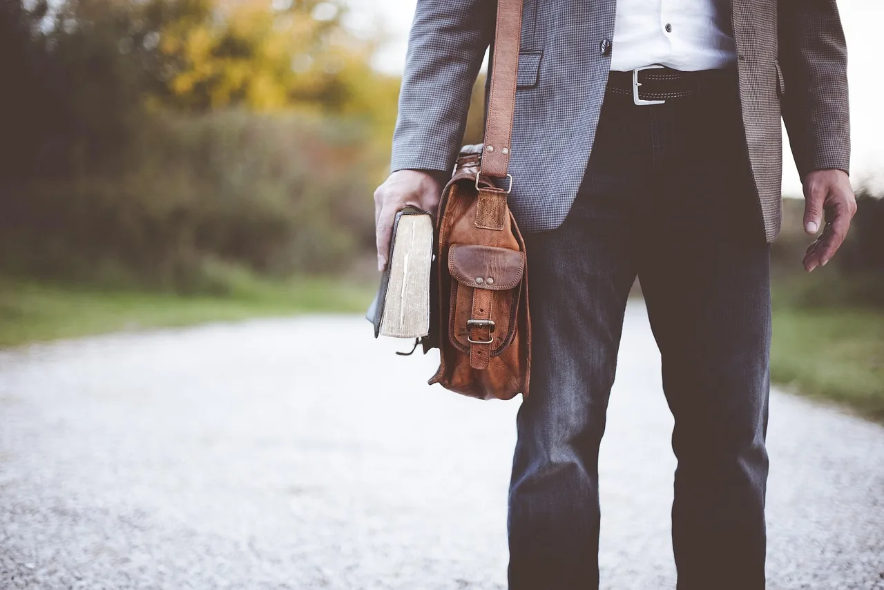bag, book, man, fashion, pants, satchel, walk, teacher, professor, men's fashion, style, stylish man, teacher, teacher, teacher, teacher, teacher. Which bag and accessory trends will last, and which are just a cycle?