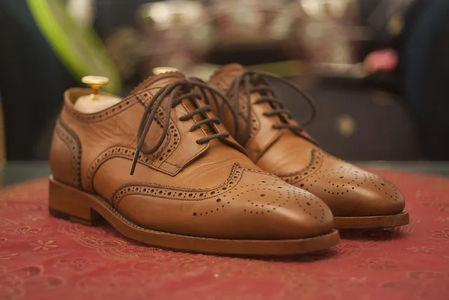 wingtip, dress shoes, leather shoes, full grain, derby, formal, brogue, brogues shoes, broguing, brown, patina, upper class, business shoes, shoes, leather, goodyear welt, gyw, elegant, classic, executive, collection, fashion, lifestyle, businessman, style, fashionable, elegance, professional, boss, stylish, luxury, luxury lifestyle, clothing, brown business, brown fashion, brown clothes, brown company, brown shoes, brown businessman, dress shoes, leather shoes, leather shoes, shoes, shoes, shoes, shoes, shoes. Where is an industry dress code actually written down, and by whom?