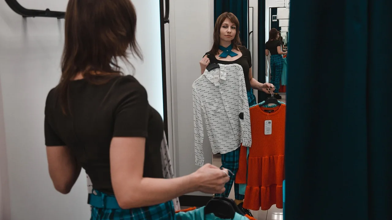 shop, fitting, clothes, purchase, to measure clothes, shirt, model, young woman, dresses, woman, portrait, gate, trying, wears, buttons, fashion, style, mirror, closet, dressing room, pullover, closet, closet, closet, closet, closet. Work dress mistakes caught in the fitting room, one seam at a time